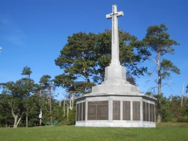 Memorial Day concept. Sarasota National Cemetery with rows of white tomb stones and USA flag on green grass